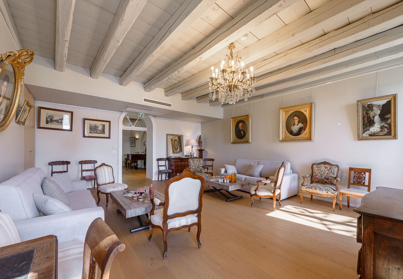 Villa's living room with balcony access and lake view